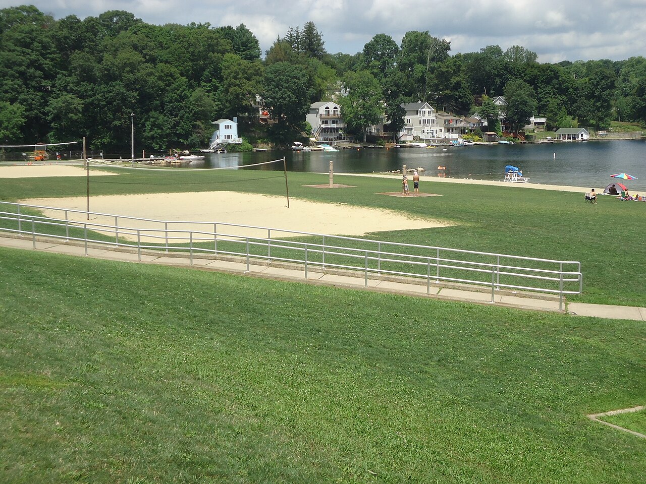 Lake_Hopatcong_view_with_grass_and_trees_and_volleyball_area.jpg